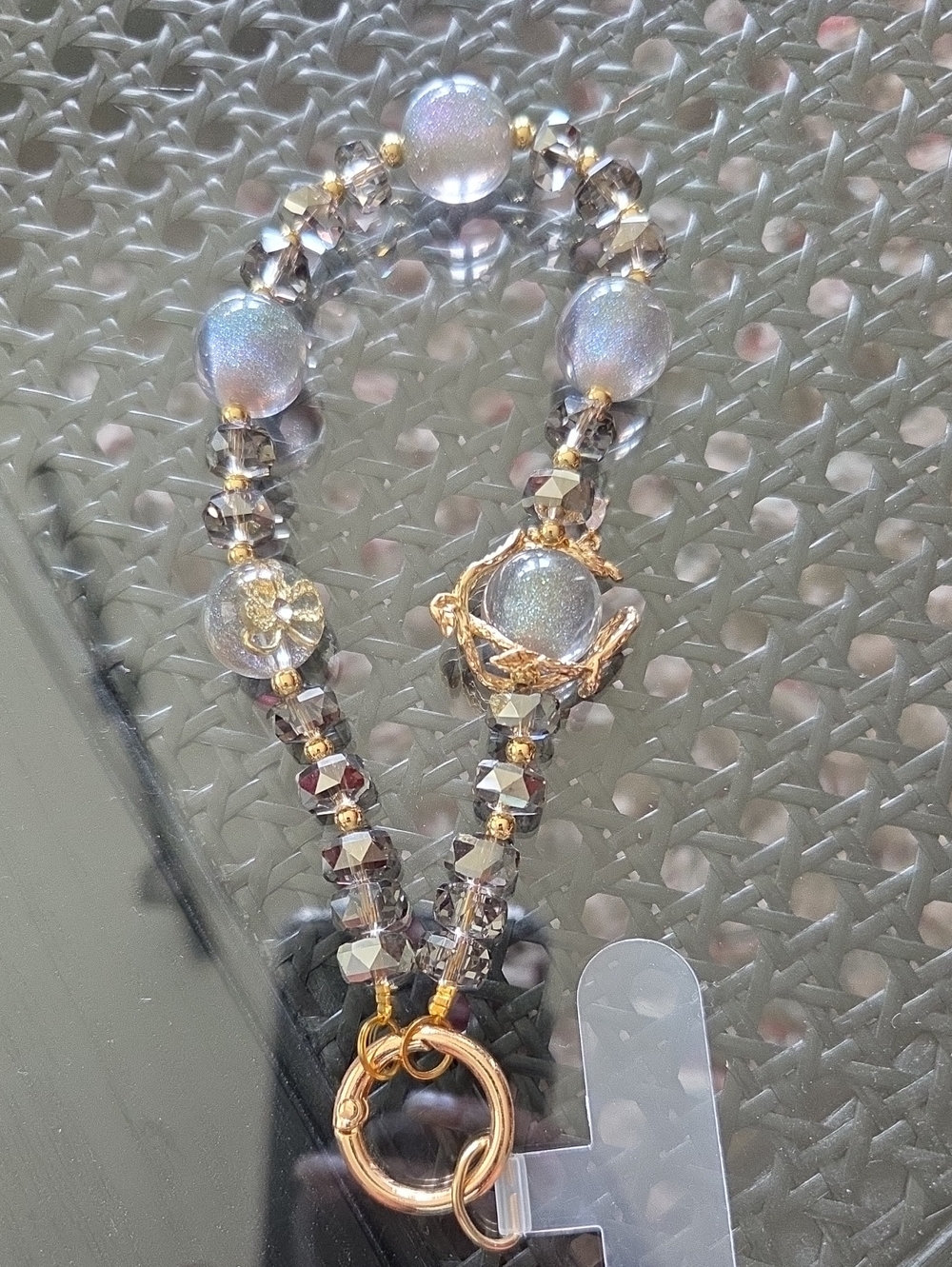 Elegant Iridescent Gray Beaded Crystal Cell Phone Bracelet with Gold Accents